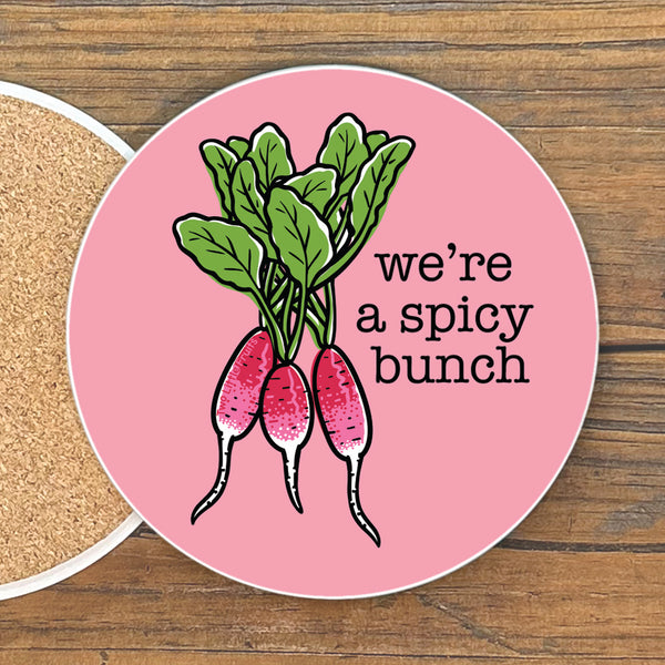 A pink coaster with a graphic of three radishes and the text "we're a spicy bunch" on it.
