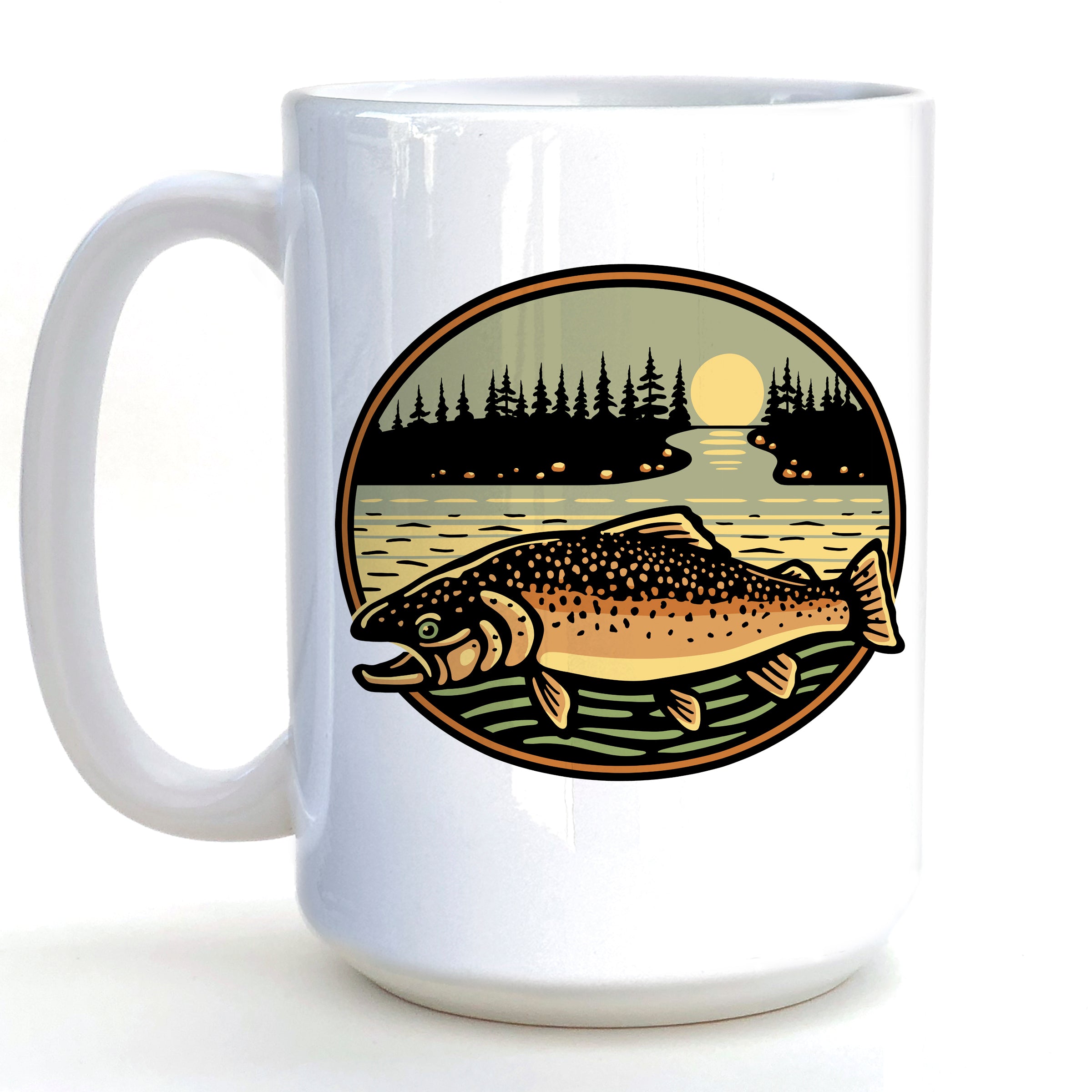 A white ceramic mug with a circular design featuring a fish swimming in a lake at sunset, surrounded by pine trees and a full moon.