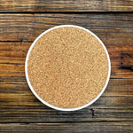 a white bowl filled with brown sugar on top of a wooden table