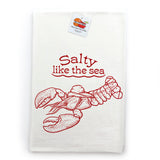 A white towel with a red illustration of a lobster and the text "Salt like the sea" printed on it.