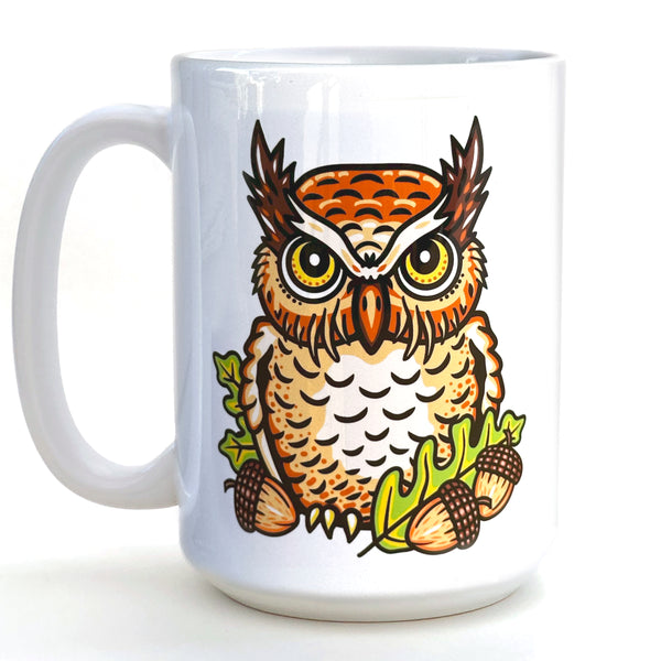 Adorable owl coffee mug featuring a colorful owl design with acorns and leaves, perfect for any coffee lover.