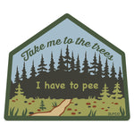 A sticker with a forest scene and a path leading to a tree.