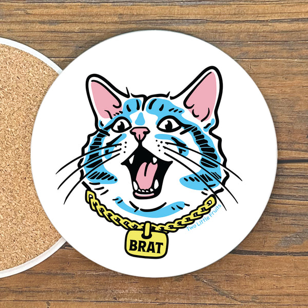 A round coaster with a cartoon illustration of a cat wearing a collar with a yellow tag that says "BRAT".