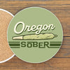 Colorful 4-Inch Oregon Sober Cannabis Drink Coaster featuring a playful design, perfect as funny coffee table coasters. Ideal for protecting surfaces with style.