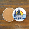 Bear Ceramic Coaster – 4" Adorable Drink Coaster with Cork Backing showing a colorful bear scene with a sunset and pine trees.
