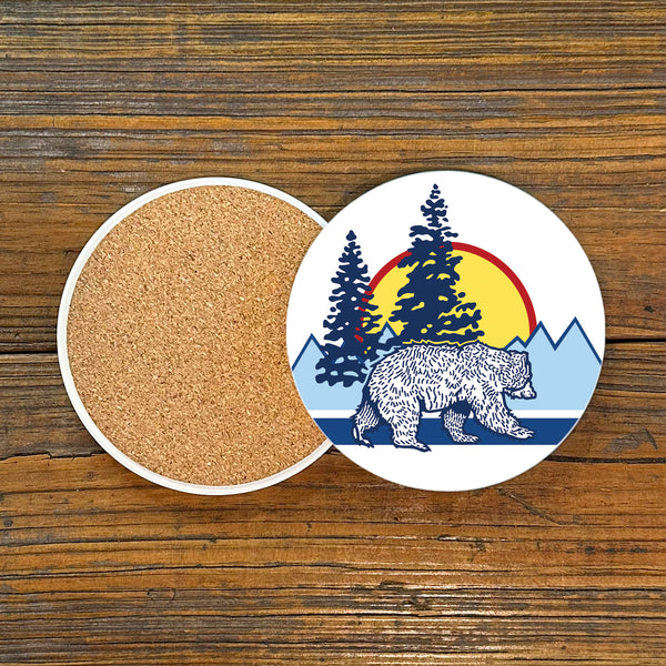 A close-up of the bear ceramic coaster showcasing a beautifully illustrated bear and mountainous scenery, perfect for adding charm to any table.