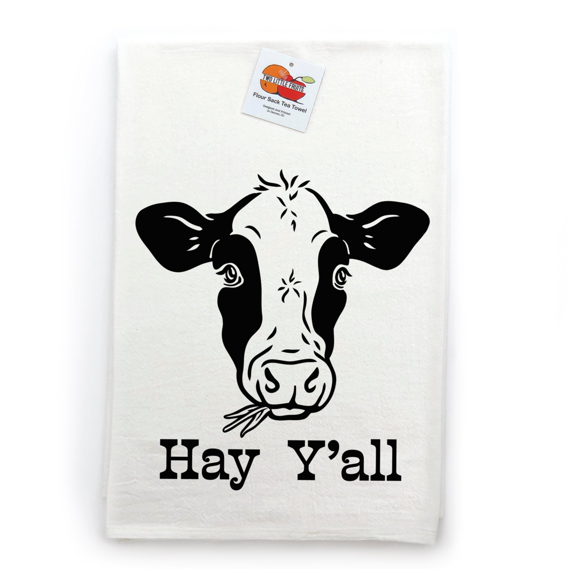 Hay Y’all Cotton Tea Towel displaying a playful cow illustration, ideal for cow themed kitchen decor, presented with its original tag.