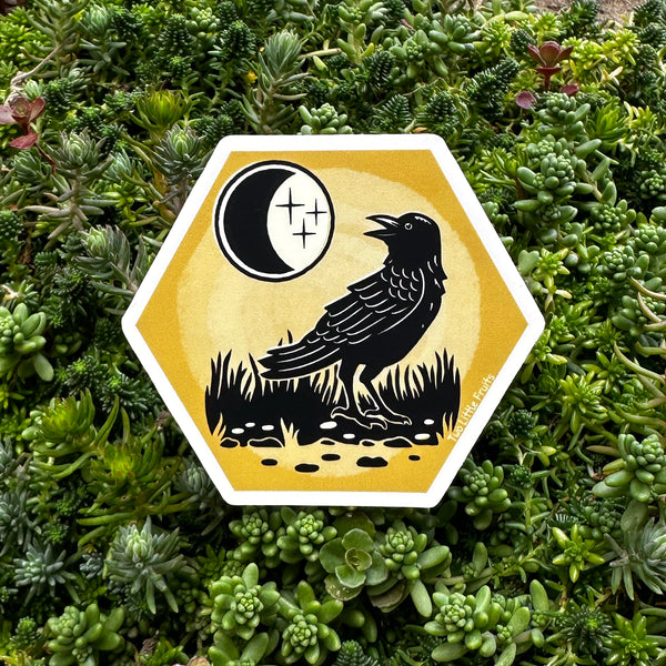 Vibrant black crow sticker featuring a crow against a golden background with a crescent moon, ideal for adding a mystical touch to any surface.