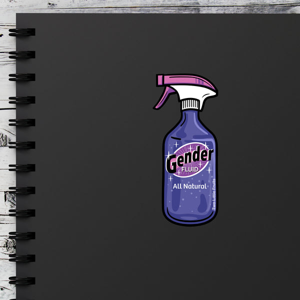 Charming Gender Fluid Sticker – LGBTQ+ Pride Vinyl Decal placed on a black notebook. A delightful queer vinyl sticker to celebrate gender expression!
