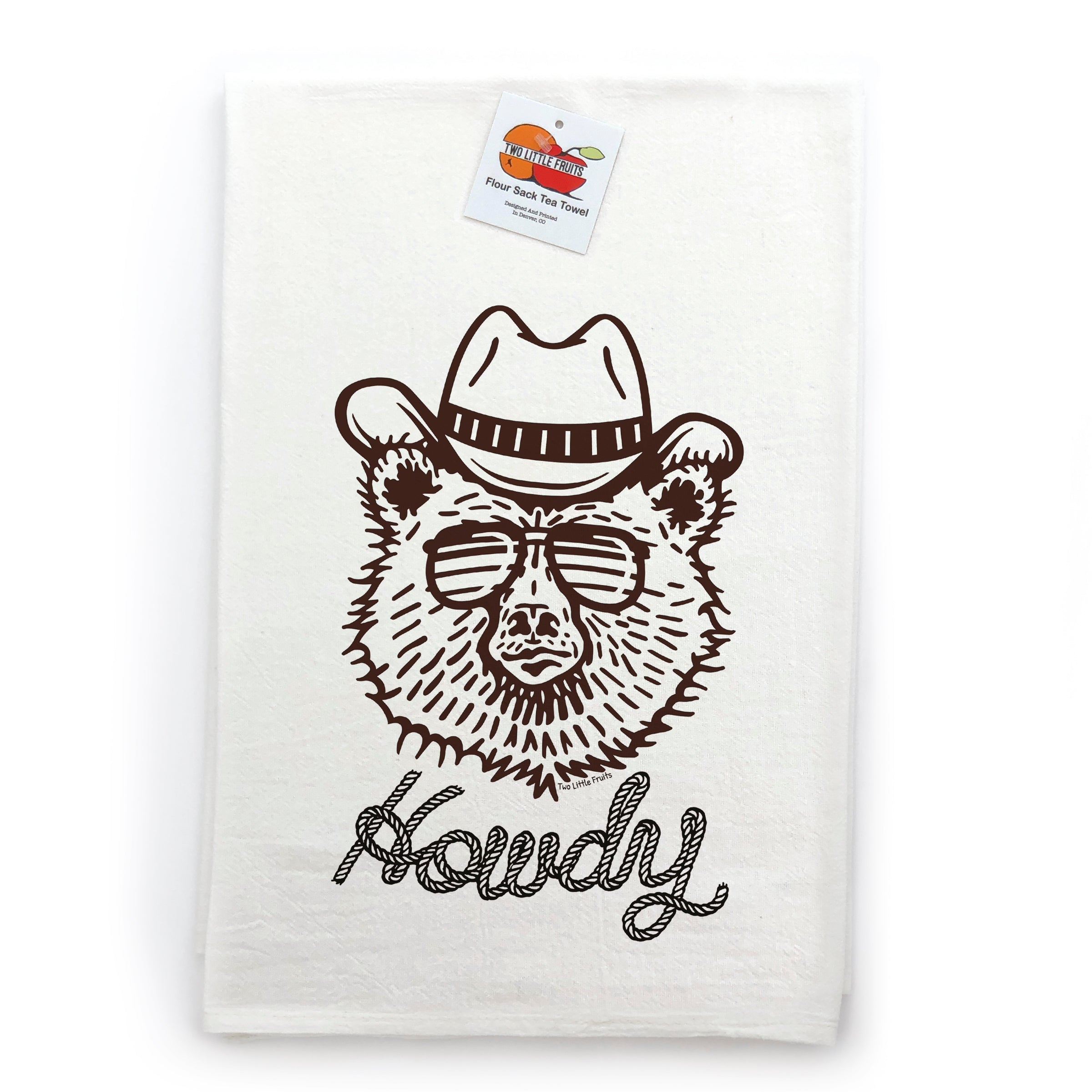 Howdy Bear Cowboy Kitchen Towel featuring an illustration of a cowboy bear wearing sunglasses and a hat, highlighting its charming and whimsical style.