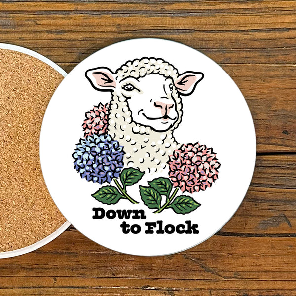 A charming Down to Flock Lamb Drink Coaster by Two Little Fruits, featuring an illustration of a smiling lamb surrounded by colorful flowers. Perfect as a fun accent for your table. Ideal for anyone looking for coasters, new.