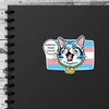 Protect Transgender Youth Cat Sticker placed on a black notebook, showcasing the vibrant design and cheerful message 'Purrtect Trans Youth!' Ideal for those seeking transgender youth support stickers while celebrating LGBTQ PRIDE. A delightful new addition to your sticker collection!