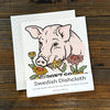Eco-Friendly Swedish Dishcloth - Don't Go Bacon My Heart Pig design displayed on a wooden surface, showcasing its reusability and eco-friendly features.
