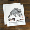 Raccoon Dish Rag - Eco-Friendly, Biodegradable Swedish Dishcloth displaying a fun raccoon carrying a container, perfect for eco-friendly cleaning.