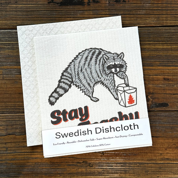 Raccoon Dish Rag - Eco-Friendly, Biodegradable Swedish Dishcloth displaying a fun raccoon carrying a container, perfect for eco-friendly cleaning.