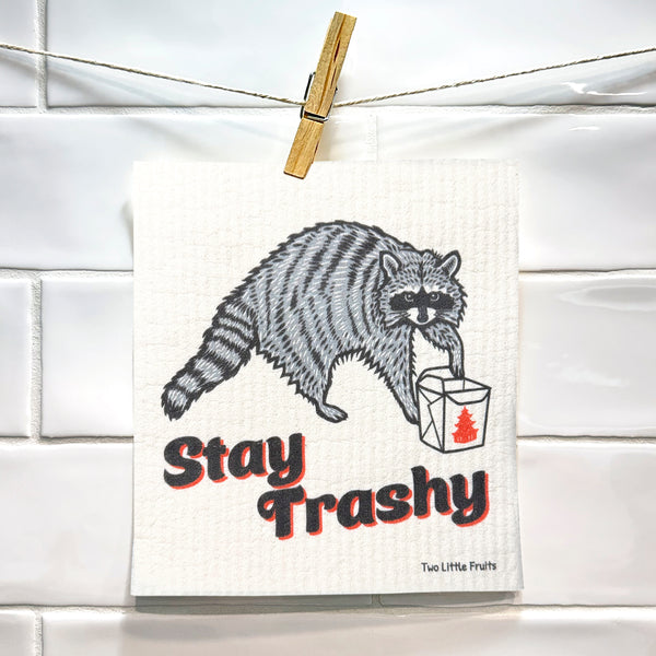 Raccoon Dish Rag - Eco-Friendly, Biodegradable Swedish Dishcloth hanging on a line, emphasizing its playful design and charming cleaning capabilities.