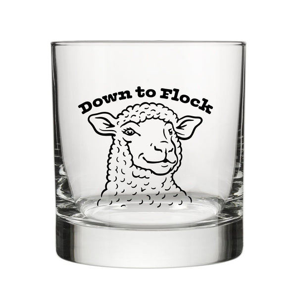 Clear Funny Lamb Whiskey Glass displaying a lamb illustration and the words 'Down to Flock,' ideal for whiskey lovers.