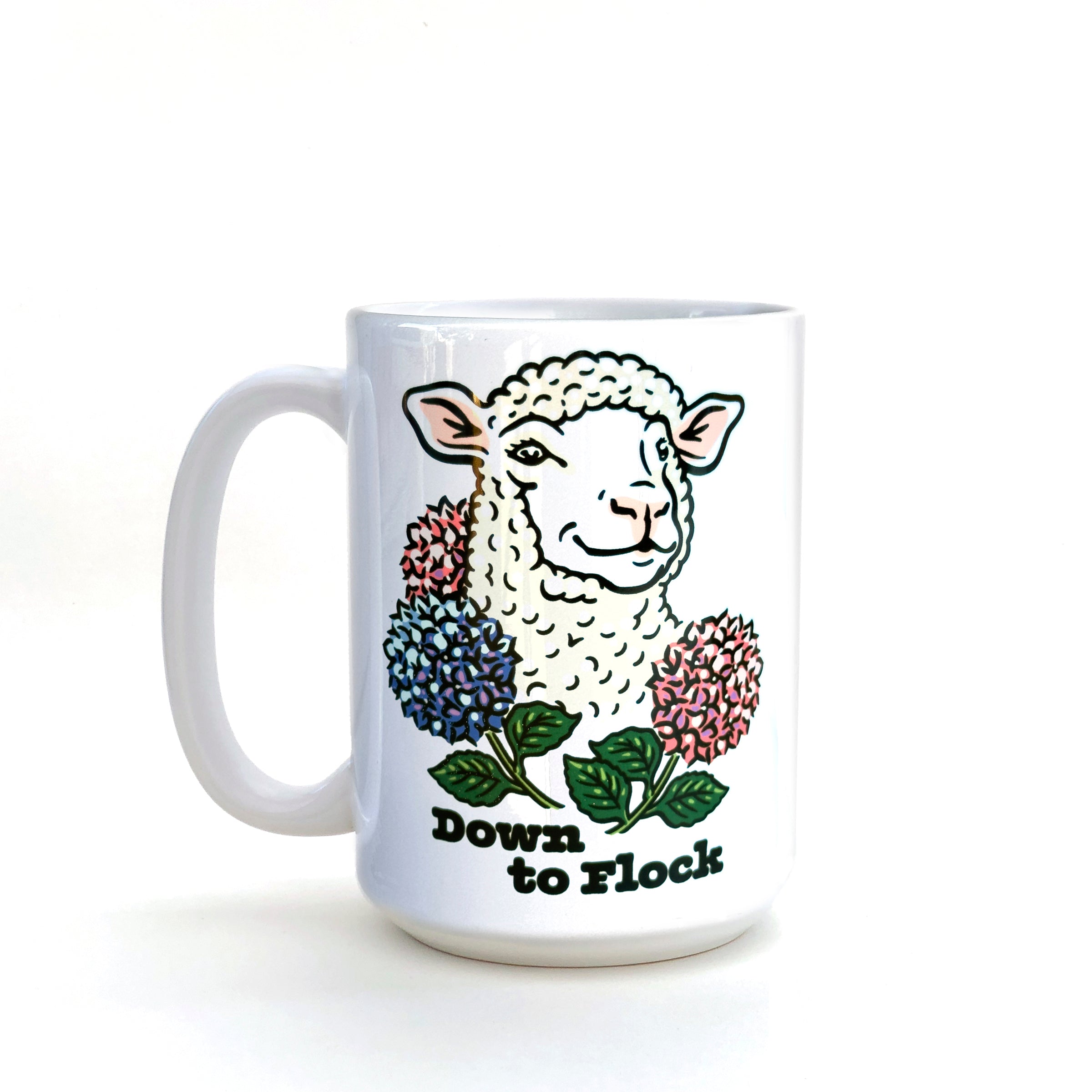 Side view of an adorable coffee mug showcasing a cheerful lamb design with hydrangeas and the text 'Down to Flock', perfect for adding charm to any beverage.