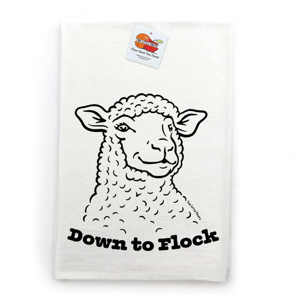 Charming flour sack tea towel featuring a cute lamb design and the phrase 'Down to Flock', hung against a white background.