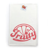 a white towel with a pink graphic design on it, which appears to be a logo or brand name.