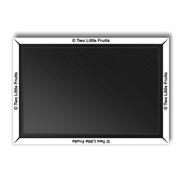 a black and white picture frame with two little fruits on it