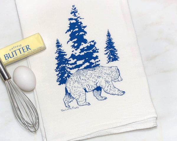 Adorable Bear Kitchen Towel – Hand-Drawn Design in Royal Blue depicting a delightful bear walking through pines, a charming addition to your kitchen essentials.
