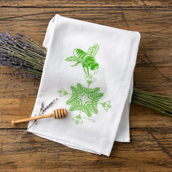 Adorable green bee tea towel design with a poppy flower background, showcasing unique tea towel designs ideal for drying dishes.