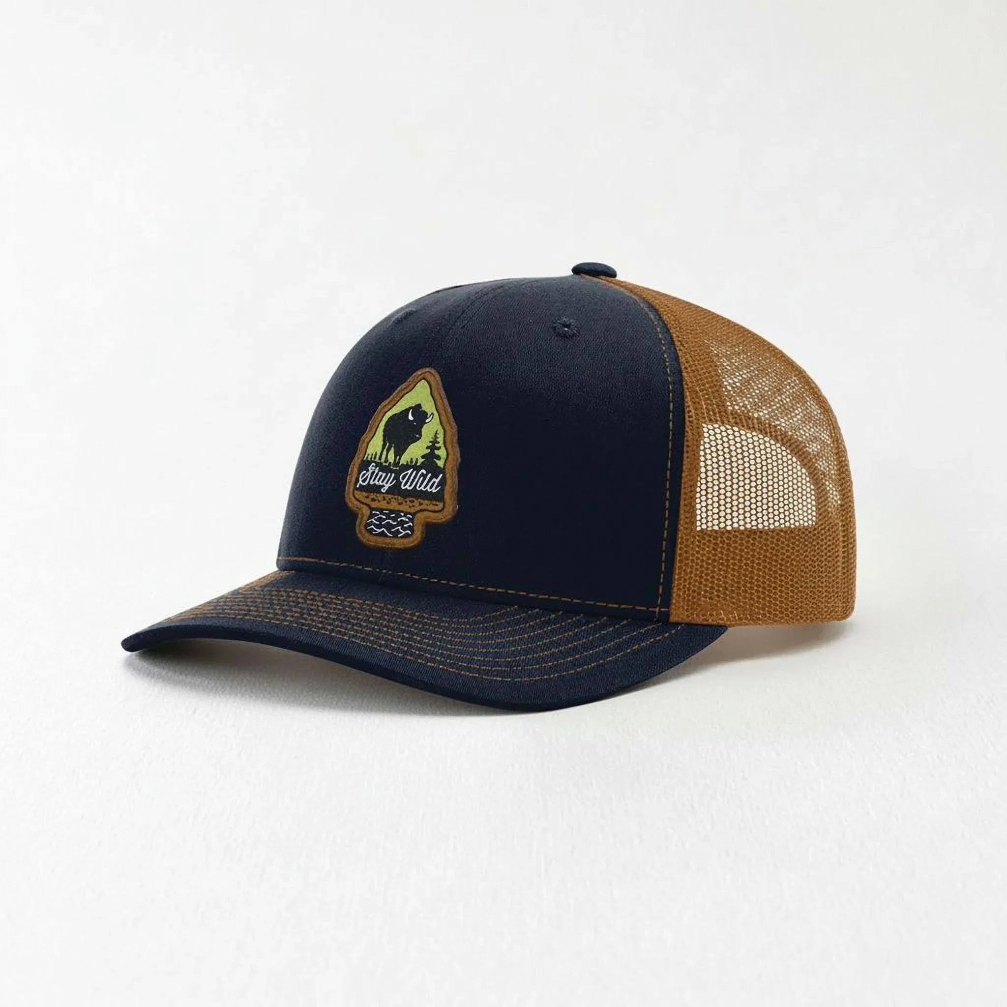 A navy blue baseball cap with a mesh panel on the side.