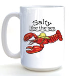 A white ceramic mug with a printed design of a red lobster wearing a yellow hat and the text "Salt like the sea" printed on it.