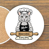 A cat wearing a chef's hat and apron, holding a rolling pin and the text "Make the Biscuits Everyday"