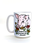 Close-up of Funny Pig Coffee Mug illustrating the charming phrase 'Don’t Go Bacon My Heart' with floral elements, ideal for adding humor to your morning.