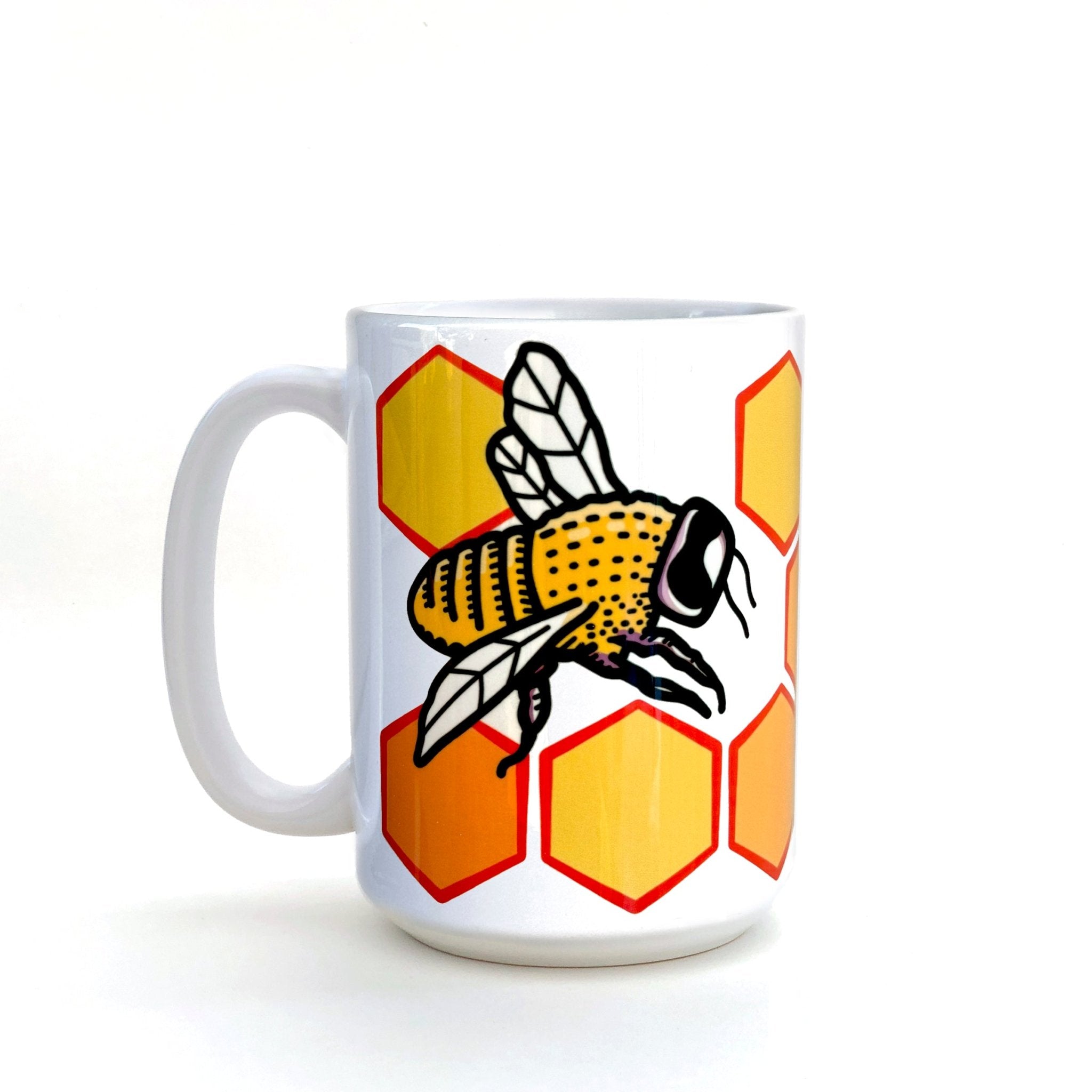 Side view of the Honeybee Coffee Mug - 15 Oz Heavy-Duty Ceramic showcasing a cheerful honeybee design on a bright hexagon pattern, ideal for coffee lovers.