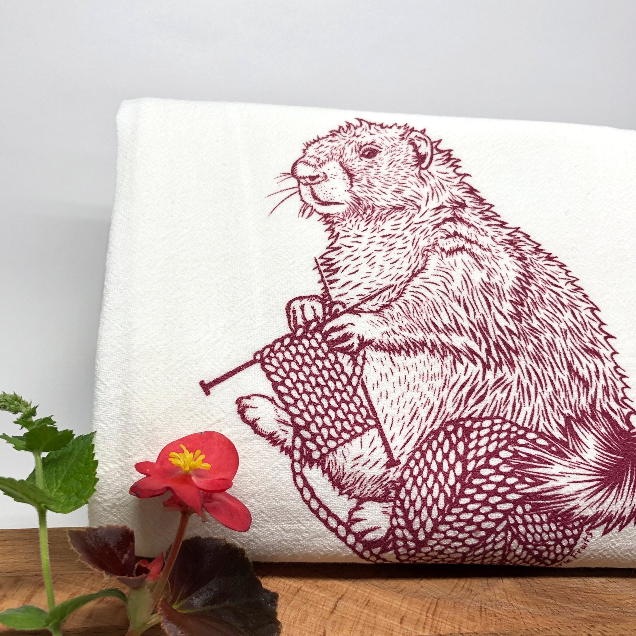 Unique Knitting Kitchen Towel with a hand-illustrated knitting marmot design by Two Little Fruits, great for gifting and home decor.