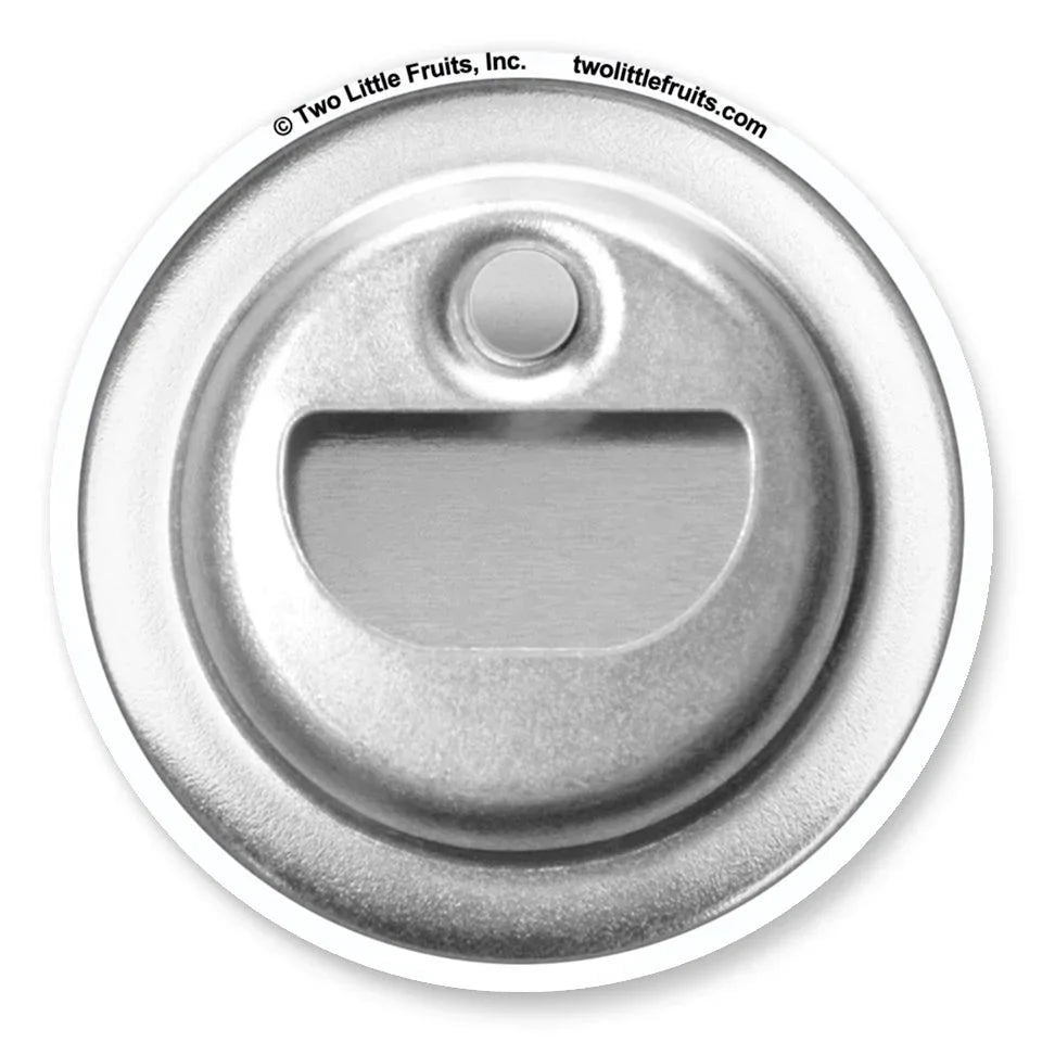 A close-up view of a metal bottle opener with a circular shape and a small hole in the center.