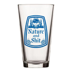 A clear glass with a blue and white label that says "Nature and Shit".