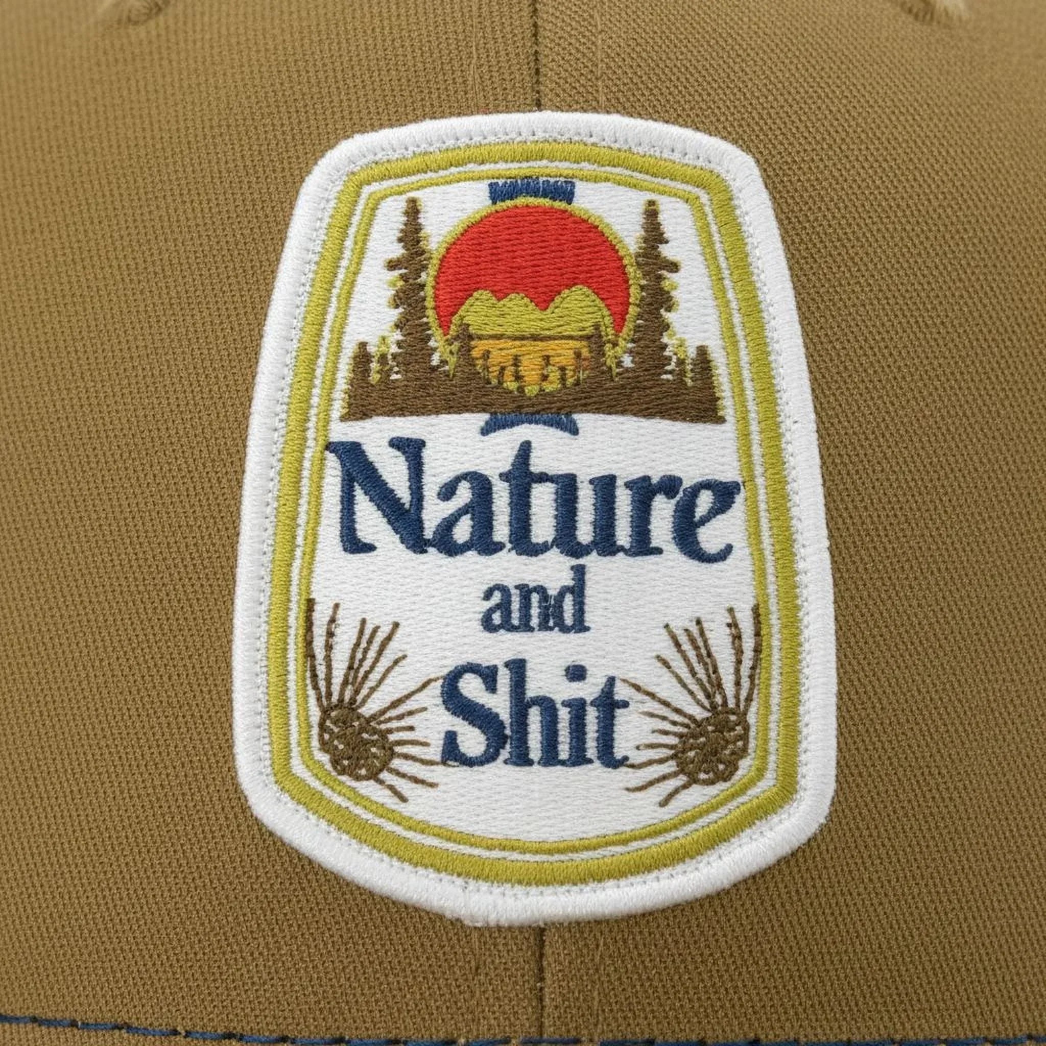 A patch with the text "Nature and Shit" and an image of a mountain landscape with a sunset.