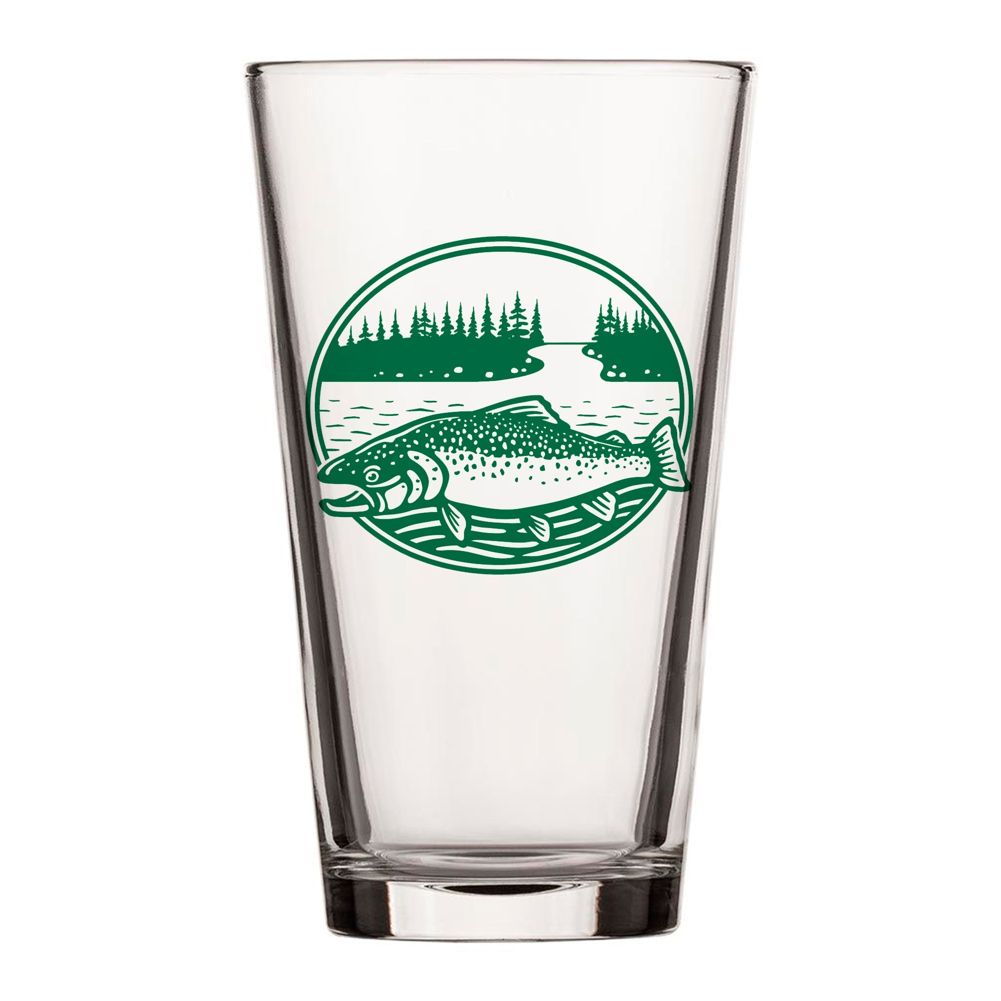 A clear glass with a green circular design featuring a fish and a forest landscape.