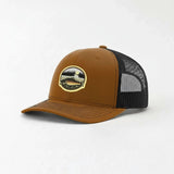 A brown baseball cap with a black mesh panel on the side, featuring a patch with a scenic landscape design.
