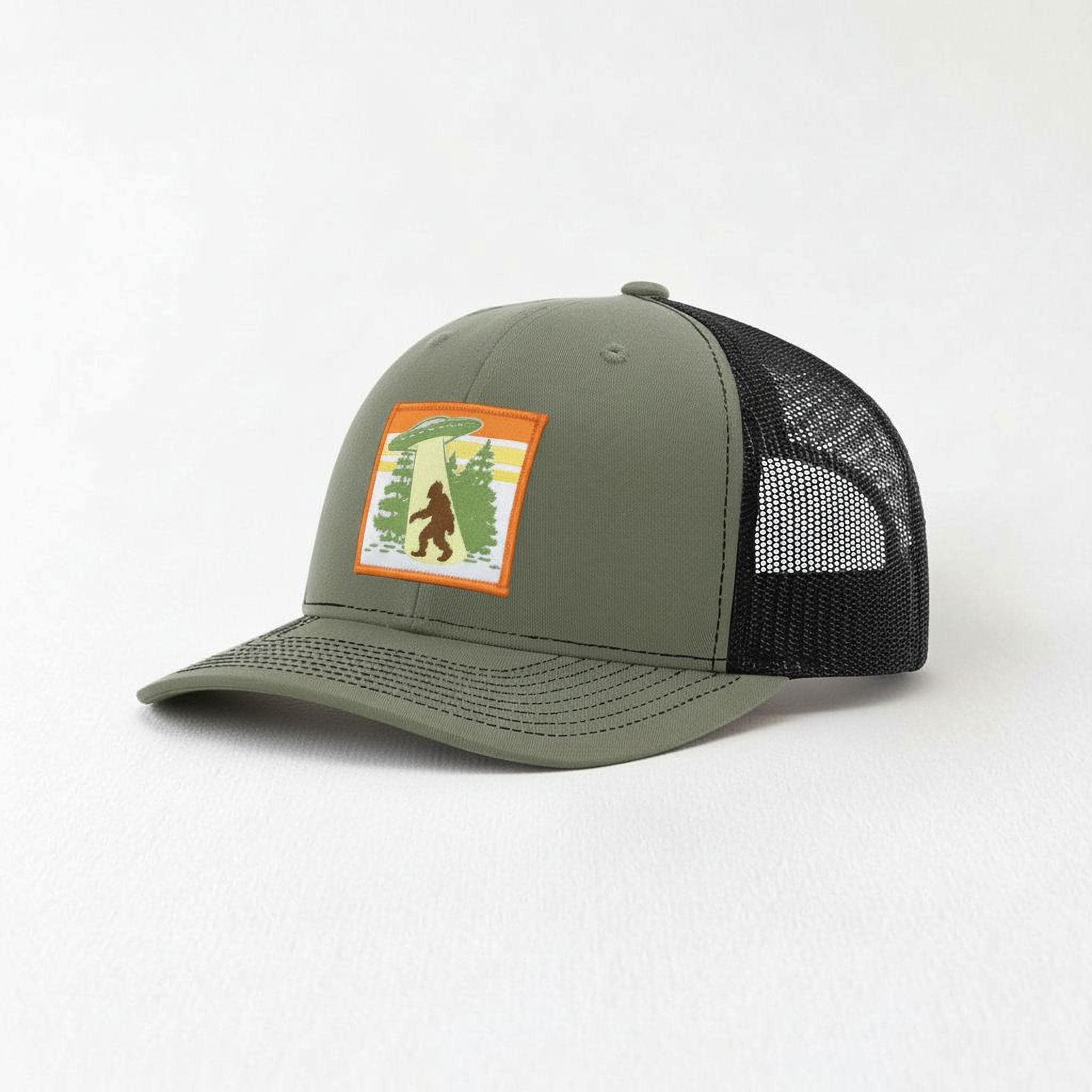 A green baseball cap with a mesh panel on the side and a patch featuring a cartoon image of a person on a bicycle.