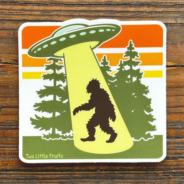 Cheerful UFO Sasquatch Laptop Sticker featuring a whimsical design, perfect for adding personality to your laptop as a sasquatch laptop sticker.