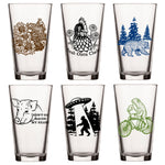 Unique Beer Glass Set - Mix And Match 6 Animal 16 Oz Pint Glasses featuring an assortment of vibrant designs with a bear, chicken, pig, and UFO, perfect for your craft beer collection.