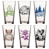 Unique Beer Glass Set - Mix And Match 6 Animal 16 Oz Pint Glasses displaying a diverse array of fun illustrations, including a frog, owl, and stay trashy raccoon, perfect for personalizing your drinkware.