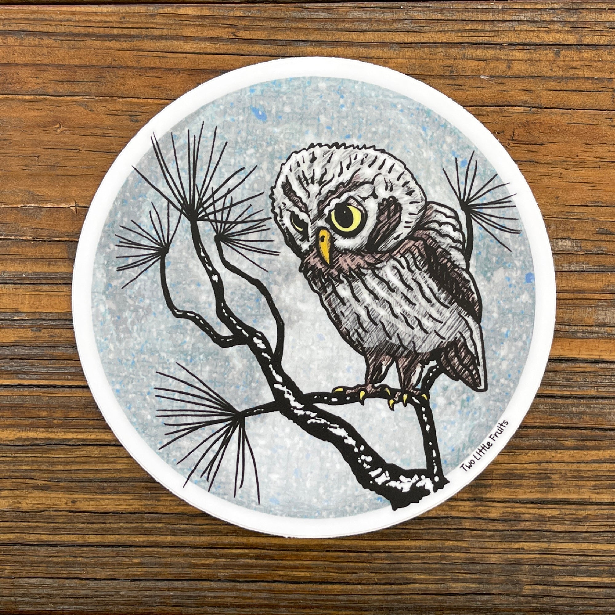 Adorable Winter Watch Owl Sticker featuring a cute owl on a tree branch, designed by Two Little Fruits. This owl vinyl sticker is perfect for personalizing your items!