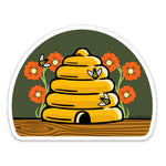 Adorable Beehive Die Cut Sticker showcasing a cute skep beehive with bees and colorful flowers, ideal for adding a personal touch.