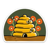 Adorable Beehive Die Cut Sticker showcasing a cute skep beehive with bees and colorful flowers, ideal for adding a personal touch.