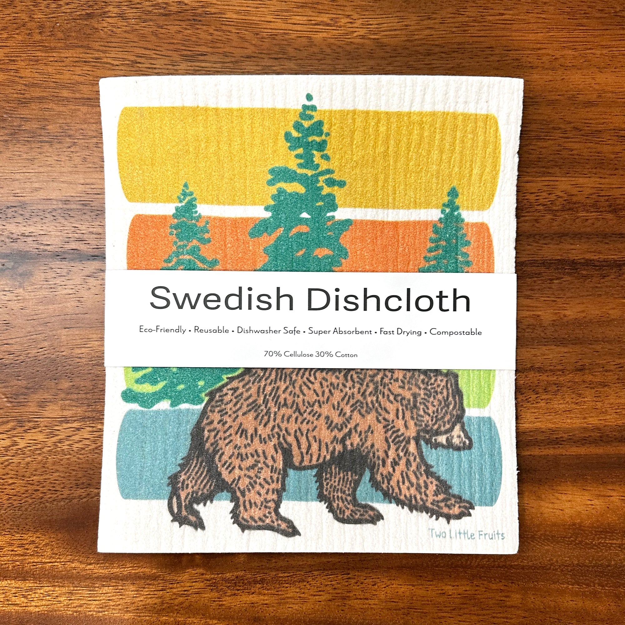 Swedish dishcloth with a charming bear illustration, packaged with eco-friendly labels emphasizing its absorbent and reusable qualities.