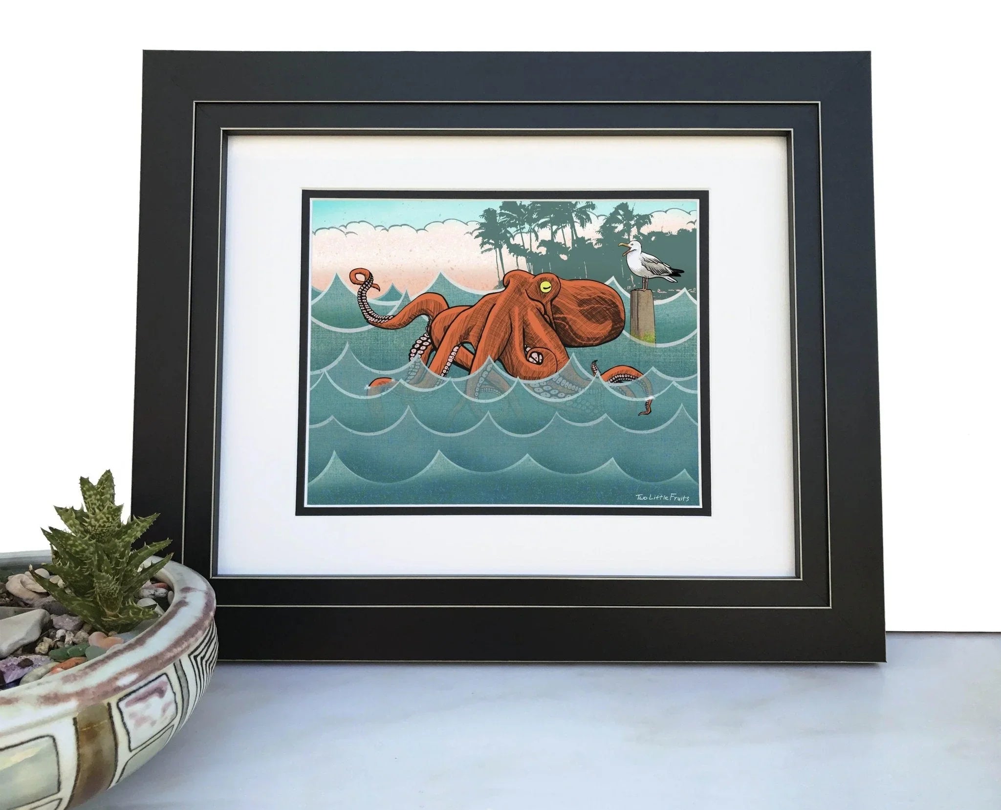 Bento The Octopus Art Print framed, showcasing a vibrant octopus design against a backdrop of ocean waves, perfect for home decor. Ideal octopus art print for art lovers.