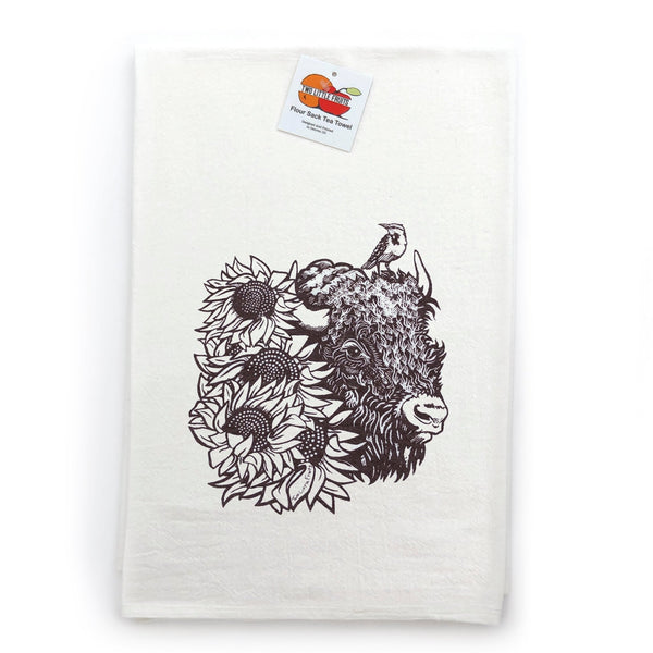Single brown bison colorful tea towel displayed with a tag, highlighting its artistic sunflower design on a white background.