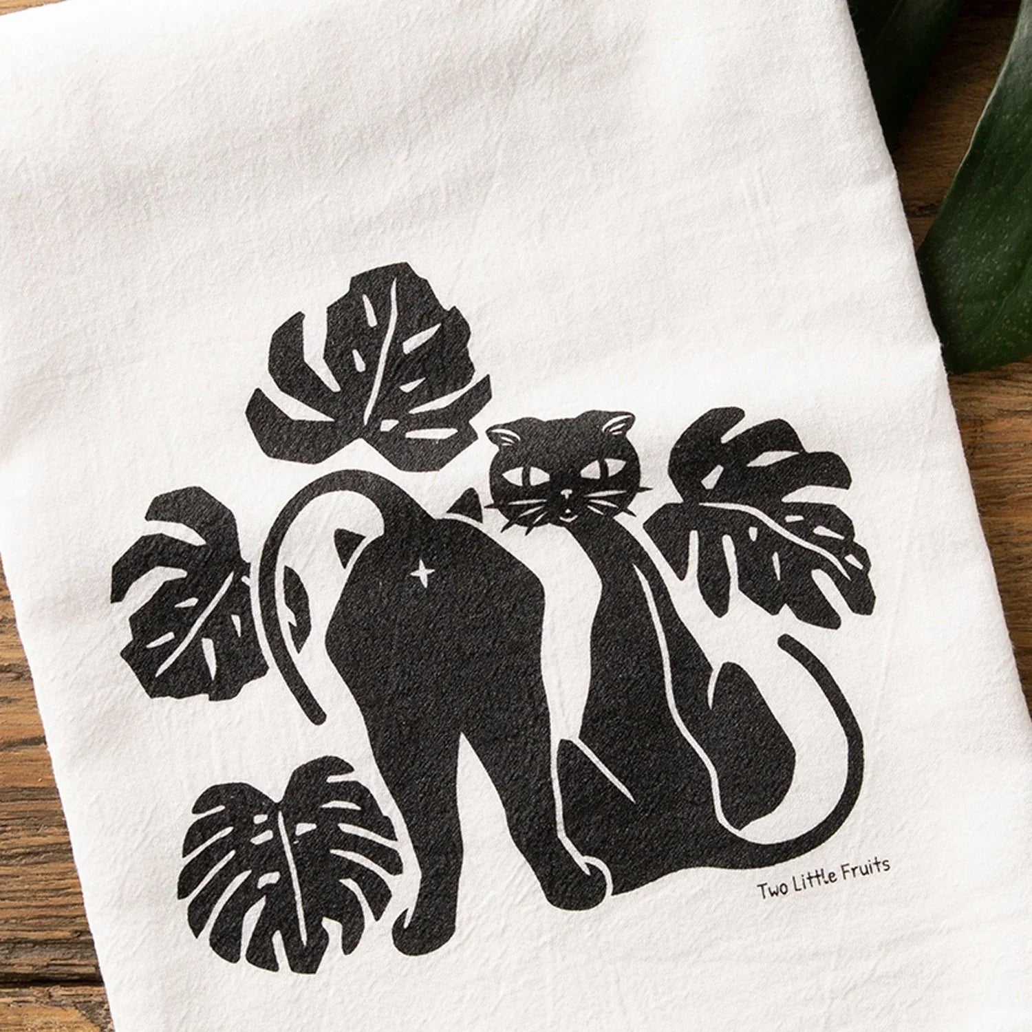 Black Cat And Monstera Leaf Cotton illustrated tea towel by Two Little Fruits