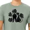 Close-up of a cat graphic t-shirt showcasing the playful design of cats surrounded by monstera leaves, made of soft heather sage fabric, ideal for casual wear.